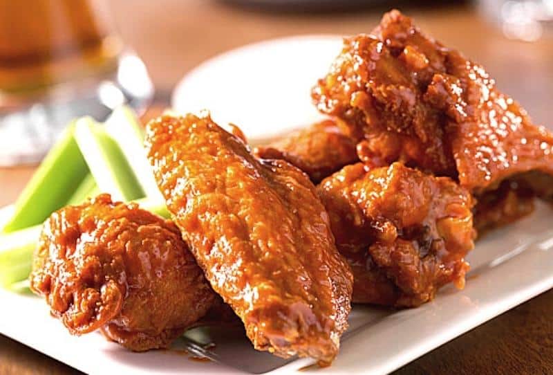 Platter of savory buffalo chicken wings from Ronzio's for adult guests at Kidz Kastle parties in Warwick, RI