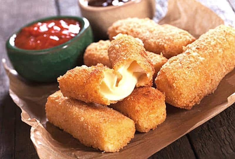 Crispy mozzarella sticks from Ronzio's served hot with a side of marinara dipping sauce at Kidz Kastle