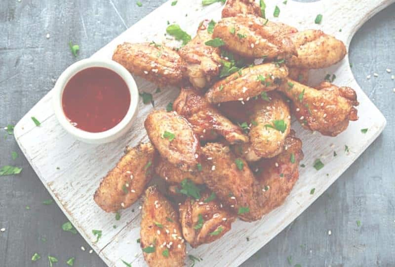Platter of savory buffalo chicken wings from Ronzio's for adult guests at Kidz Kastle parties in Warwick, RI
