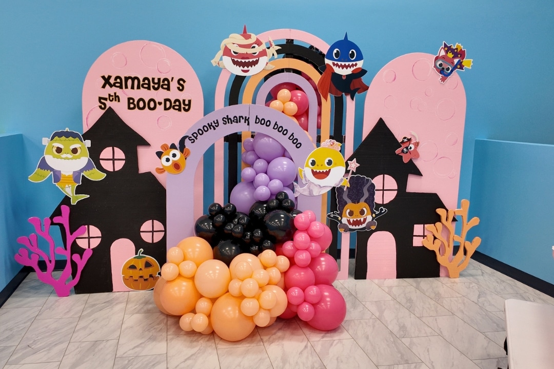 Baby Shark Halloween Spooky Shark Boo Day party with pink haunted house and underwater spooky decor at Kidz Kastle RI