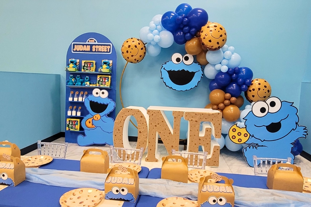 Cookie Monster themed first birthday with giant ONE letters and custom Judah Street backdrop at Kidz Kastle RI