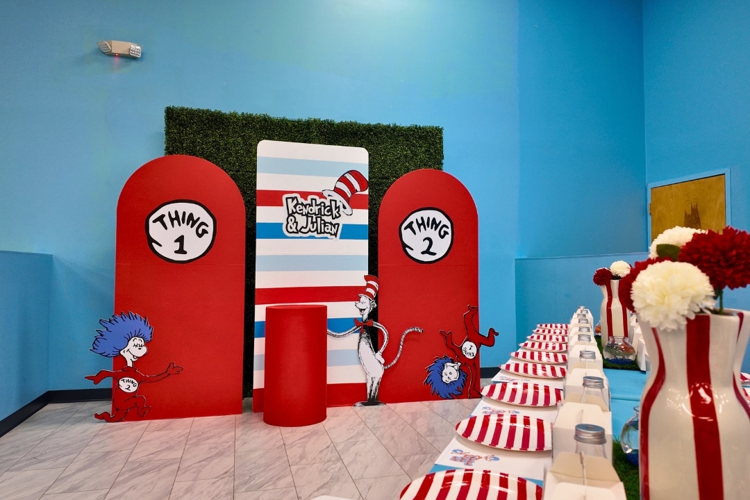 Dr Seuss themed joint birthday party for Thing 1 and Thing 2 with red and blue striped decor at Kidz Kastle RI
