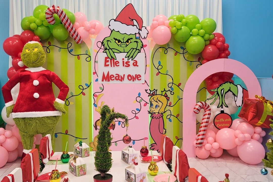 IGrinch themed Mean One birthday party with Whoville decor and Christmas balloon styling at Kidz Kastle RI