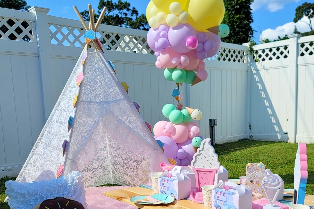 Luxury ice cream themed backyard party setup with teepee and balloon decor for kids birthday parties South Kingstown RI.