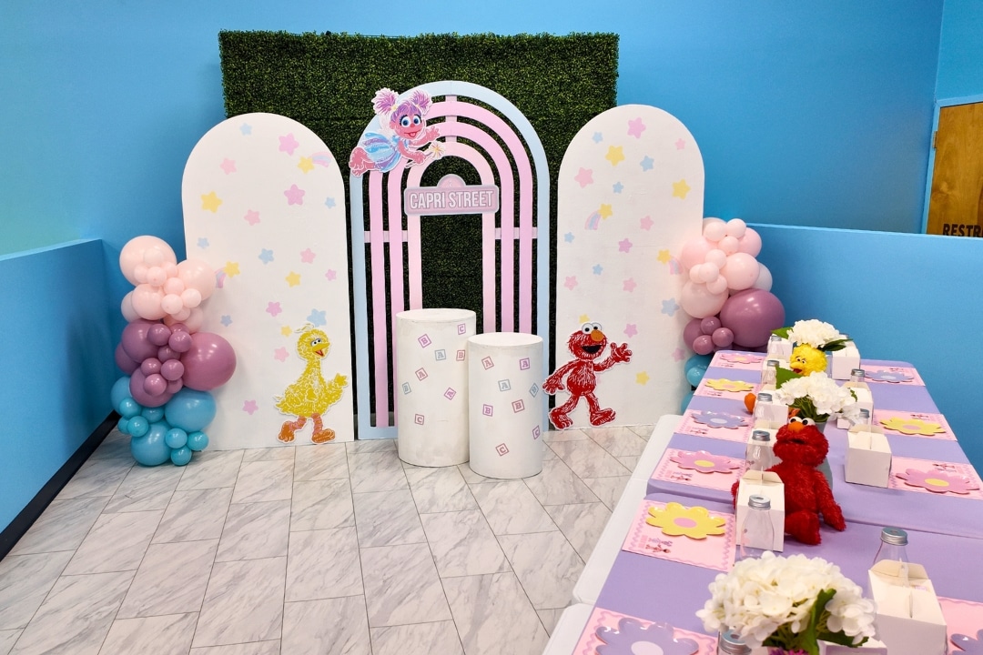 Sesame Street themed birthday party for Capri featuring Elmo, Big Bird, and Abby Cadabby decorations.