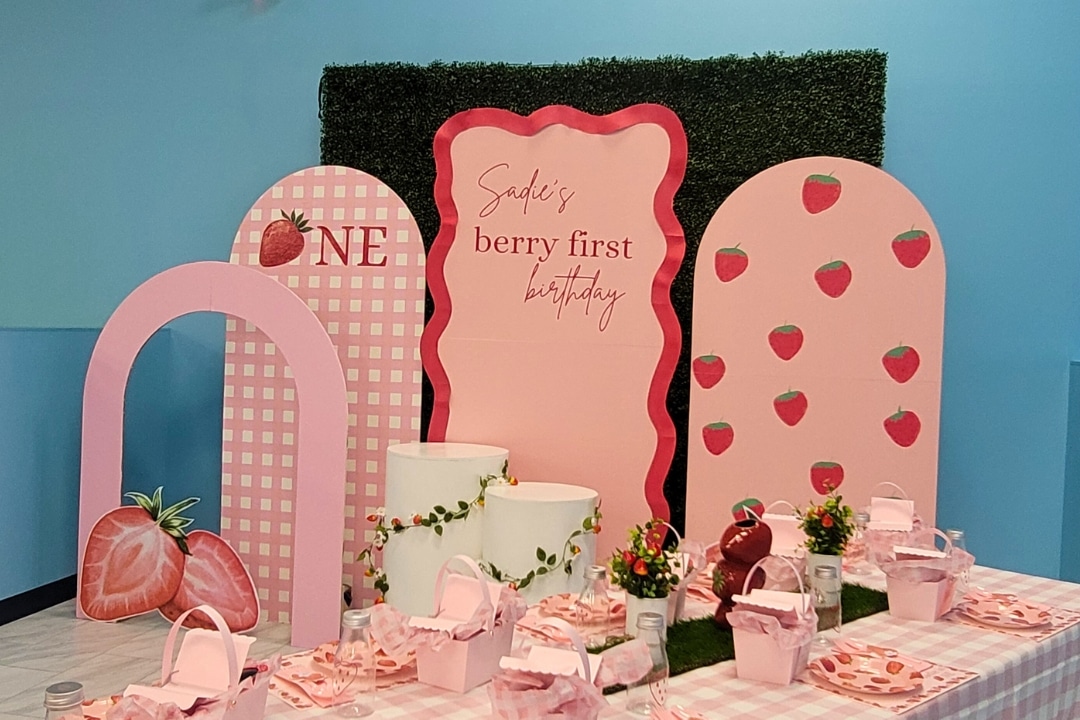 Strawberry Berry First Birthday themed party with pink gingham backdrops and fruit inspired decor at Kidz Kastle RI