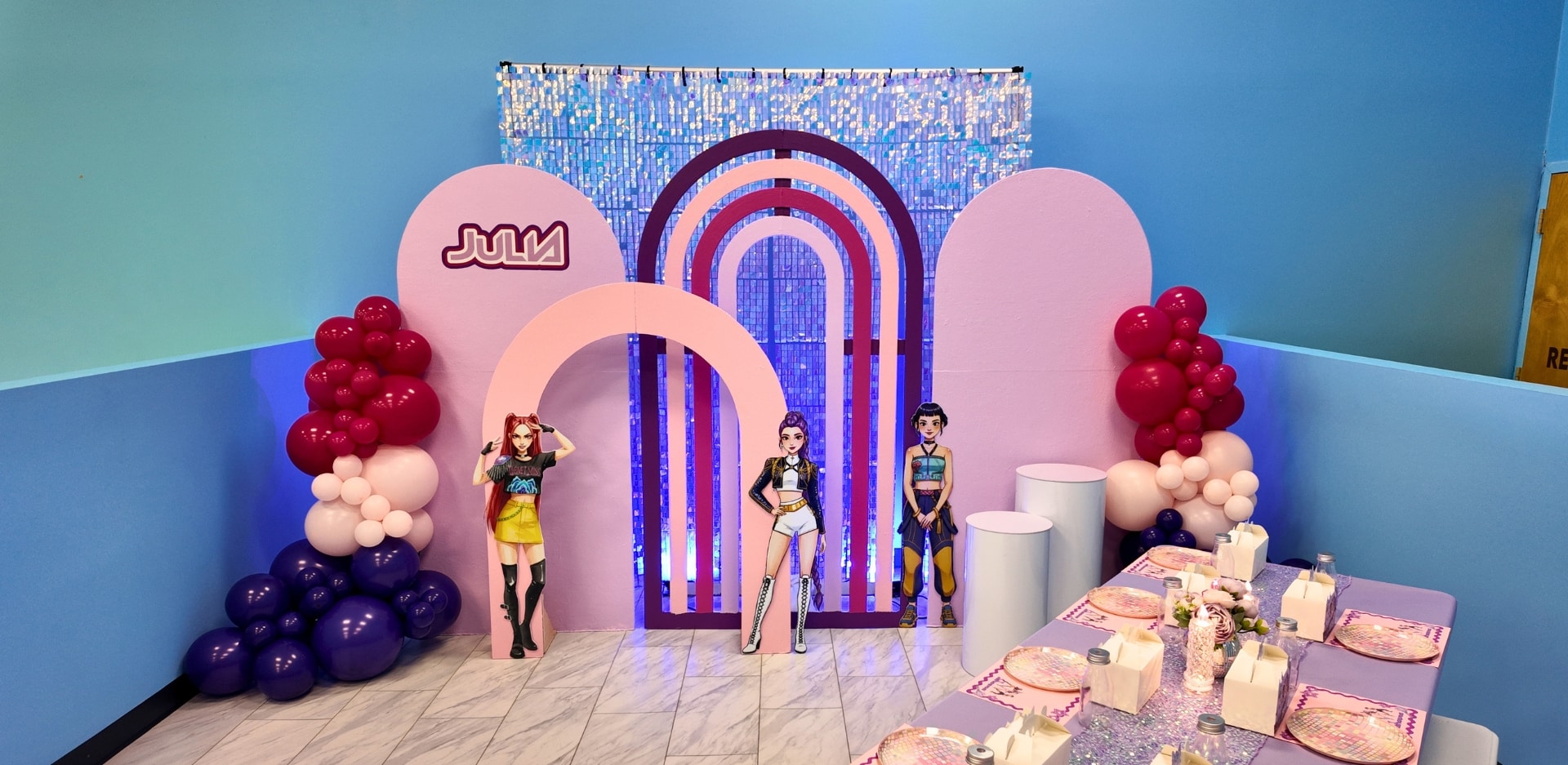 Trendy K-Pop themed birthday party decor at Kidz Kastle, highlighting our custom shimmer backdrops and premium party room styling in Rhode Island.